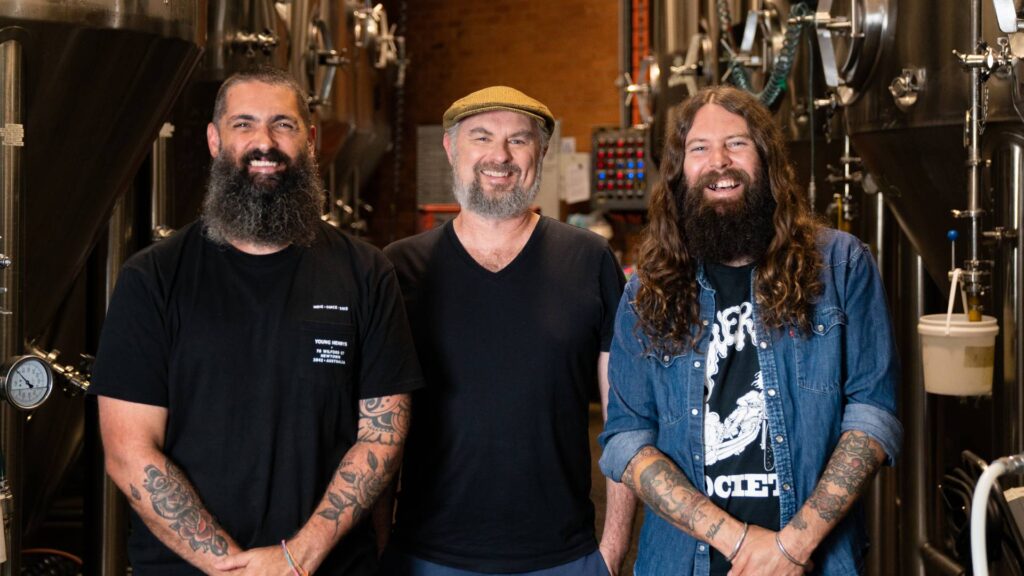 Young Henrys co-founders Richard Adamson, Dan Hampton and Oscar McMahon in the brewery.